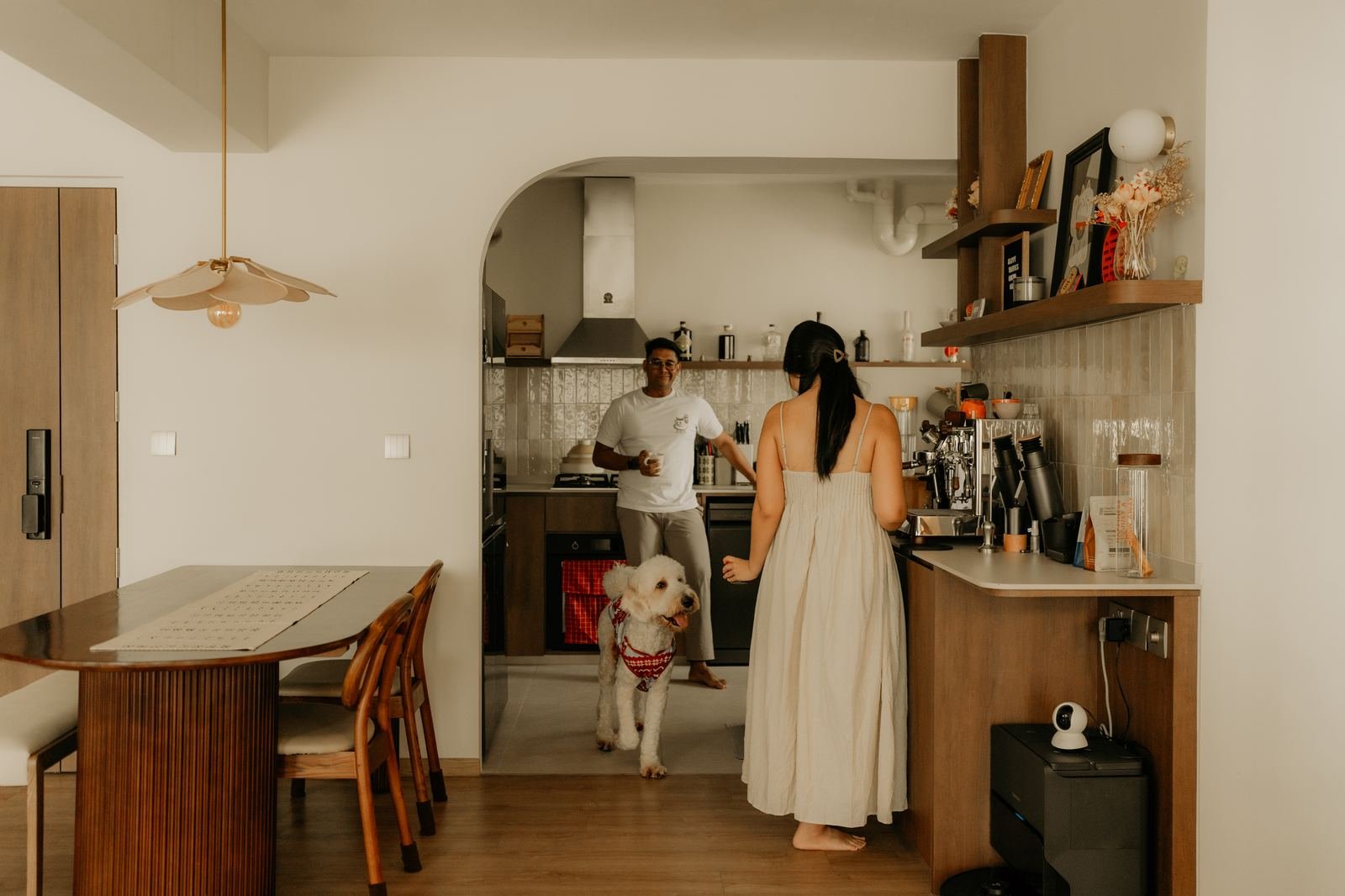 Couple and their poodle in a warm kitchen