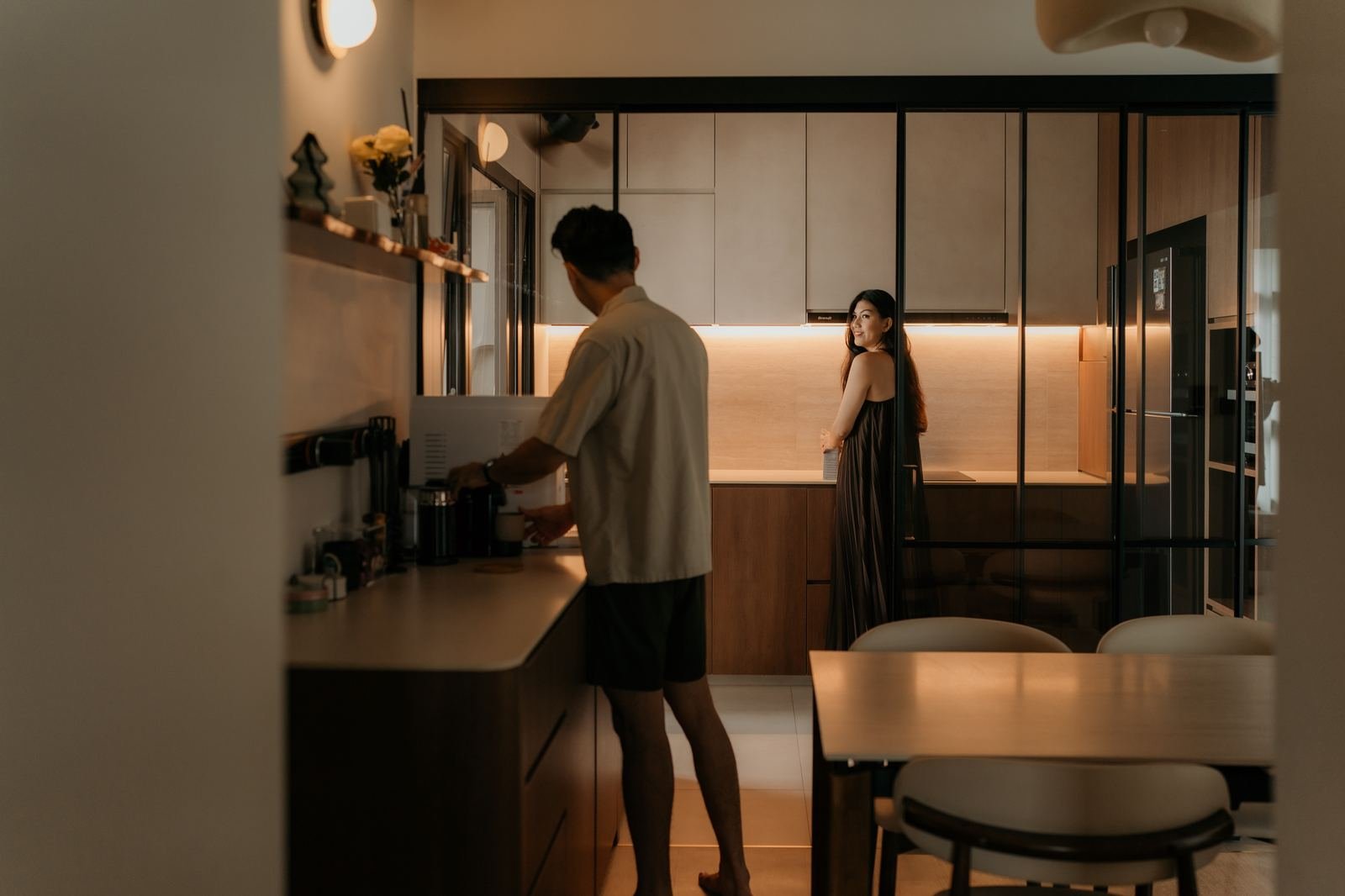 Couple in their kitchen at golden hour